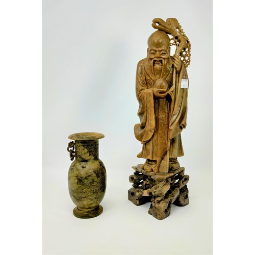 72 - A Chinese brown soapstone figure of a sage with staff and gourd, height 35 cm; a Chinese mottled gre... 