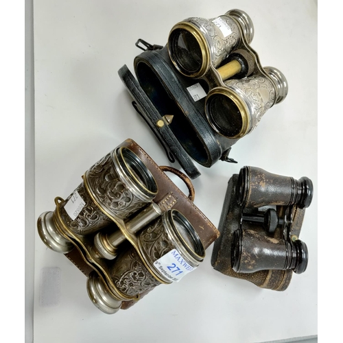 271 - Two pairs of opera glasses with hallmarked embossed silver mounts, cased; a similar leather pair
