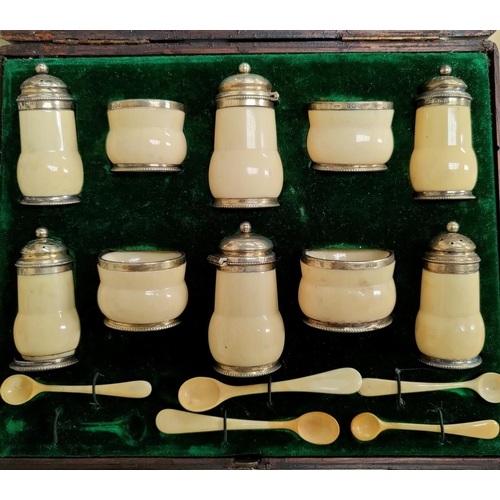 329 - An originally cased 10 piece cruet set in hallmarked silver mounted ivory, Birmingham 1902