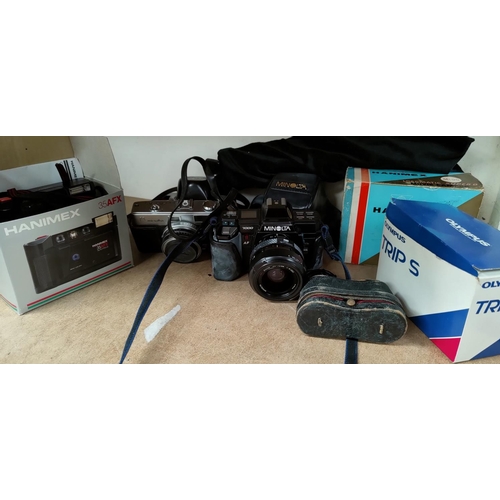 406 - A selection of pre digital cameras and accessories including 2 Minolta, Olympus and Hanimex etc