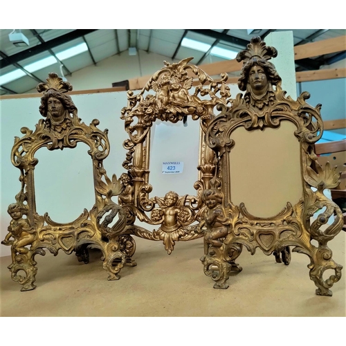 423 - A pair of gilt metal picture frames in the classical manor and a single gilt metal picture frame dec... 
