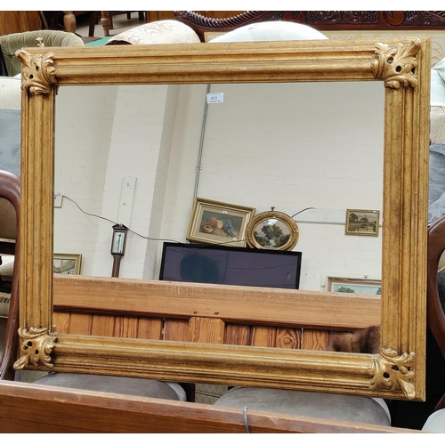 462 - A gilt framed rectangular wall mirror with accanthus corner mounts 97cm x 79 cm
A pair of table lamp... 