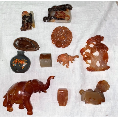 108 - A collection of Chinese agate coloured stone carved items
