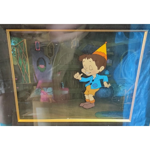475 - A film production still with a drawing of Pinocchio in a large gilt frame, glazed and with a certifi... 