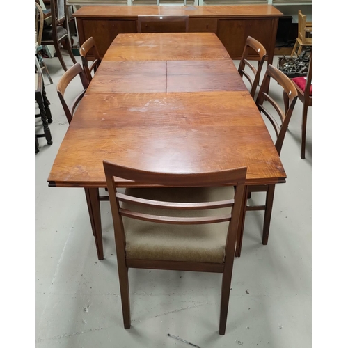 551B - A 1960's walnut / teak dining suite comprising table with extending rectangular top, 5 ladderback ch... 