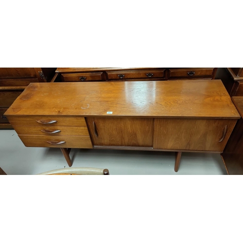 555 - A mid 20th century teak sideboard with double cupboard and triple drawers, 163 x 43cm