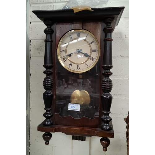 624 - A small A Victorian style pine Vienna style wall clock in mahogany case, with striking movement