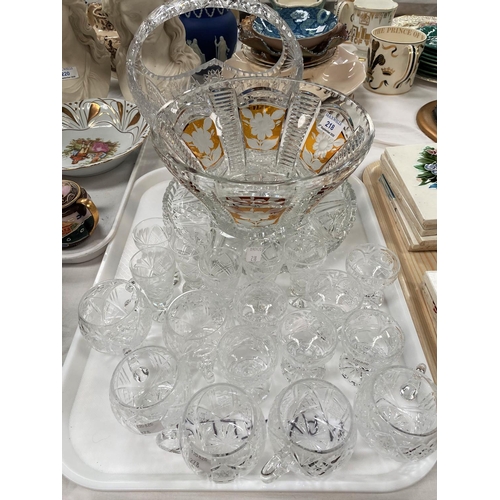 215 - An amber overlaid and cut fruit bowl, a heavy cut basket, 6 cut punch cups and other glassware