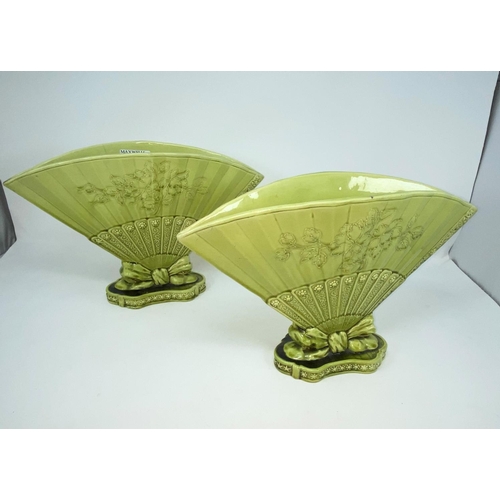 147 - A pair of green glazed 'Burmantofts Faience' fan vases, width 32cm (one hairline cracks)