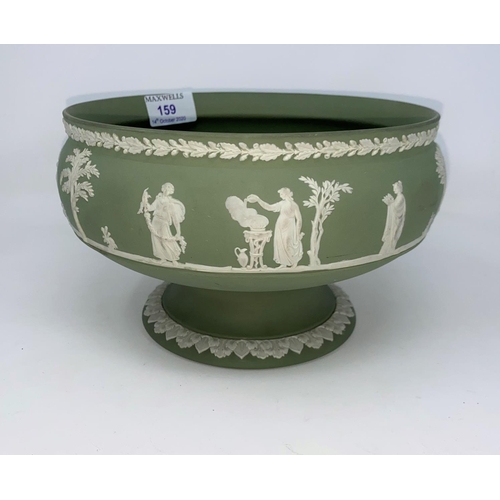 159 - A Wedgewood Jasperware green pedestal bowl decorated with classical scenes.