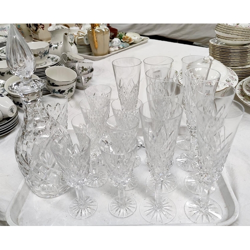 200 - A Waterford crystal decanter; a selection of  Tyrone crystal champagne and other glasses.