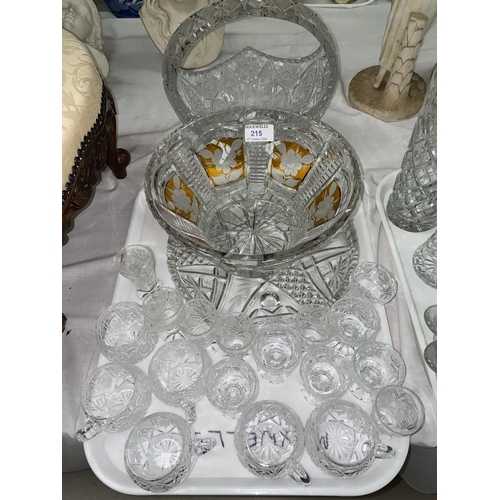 215 - An amber overlaid and cut fruit bowl, a heavy cut basket, 6 cut punch cups and other glassware