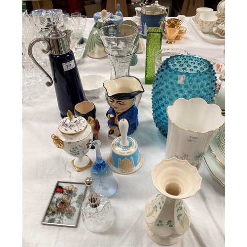 227 - A Wade blue glazed claret jug with silver plated mounts; a Belleek vase; a Coalport covered vase; et... 
