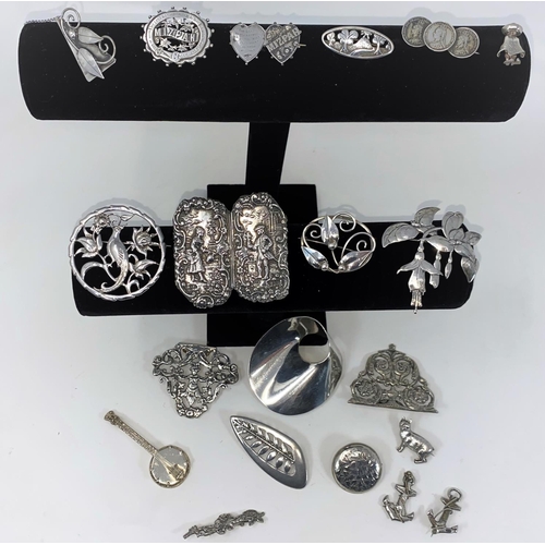 288 - A selection of silver, continental and white metal brooches, buckles etc