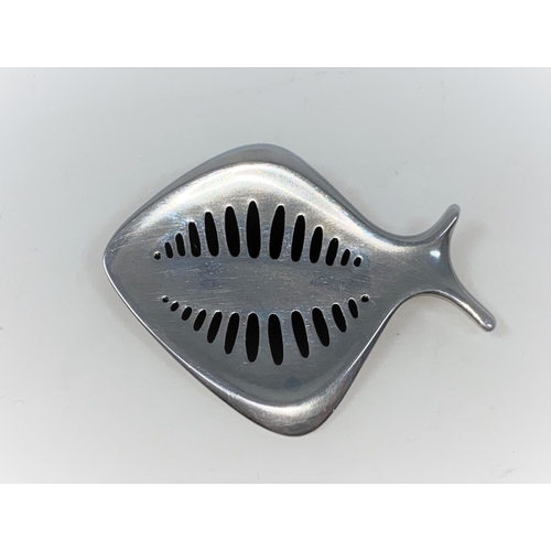 303 - Georg Jensen:  a silver brooch designed by Henning Koppel, in the form of a fish with black markings... 