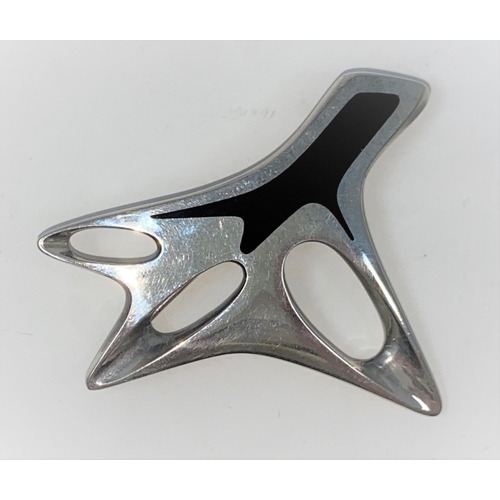 305 - Georg Jensen:  a modernist silver brooch designed by Henning Koppel, with black enamel decoration, s... 