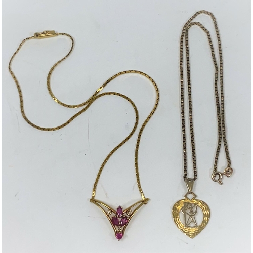 309 - A 9 carat hallmarked gold pendant on 9 carat box chain, 5.5 gm; a gilt gem set pendant