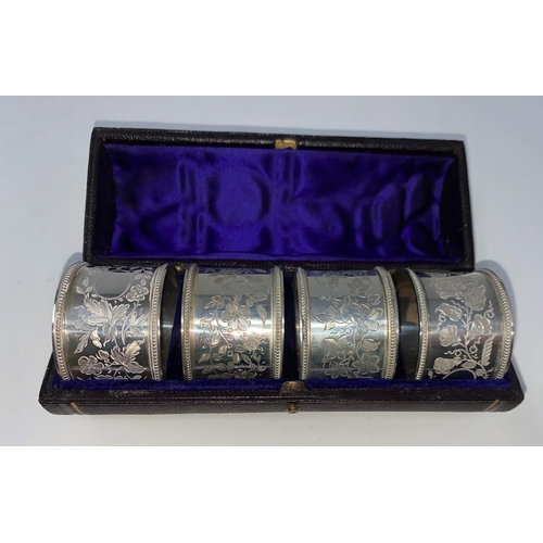 310 - A hallmarked silver set of 4 napkin rings, cased, London 1876, 2.8 oz