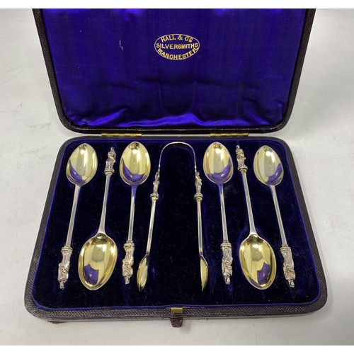 311 - A hallmarked silver set of apostle top spoons and tongs, cased, London 1876, 3.6 oz
