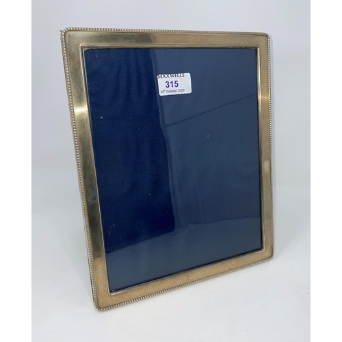 315 - A large rectangular beaded hallmarked silver photo frame 28 x 23cm, Sheffield 1992