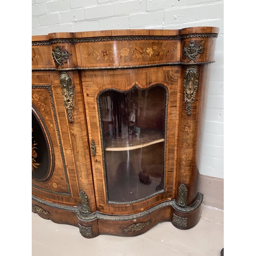 573 - A 19th century Louis XV style serpentine font walnut credenza with extensive ormolu mounts and marqu... 