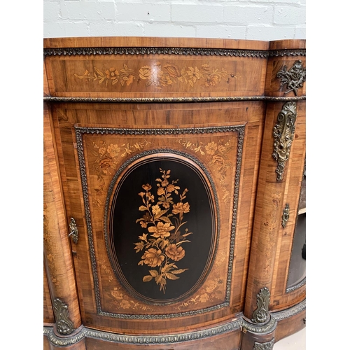 573 - A 19th century Louis XV style serpentine font walnut credenza with extensive ormolu mounts and marqu... 