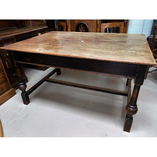 582 - A Victorian oak dining table with rectangular plank top, on turned legs