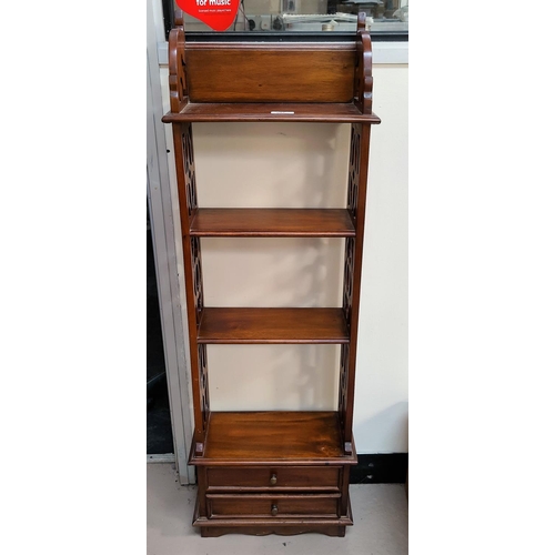 597 - A mahogany reproduction 4 height wall shelf with drawers below