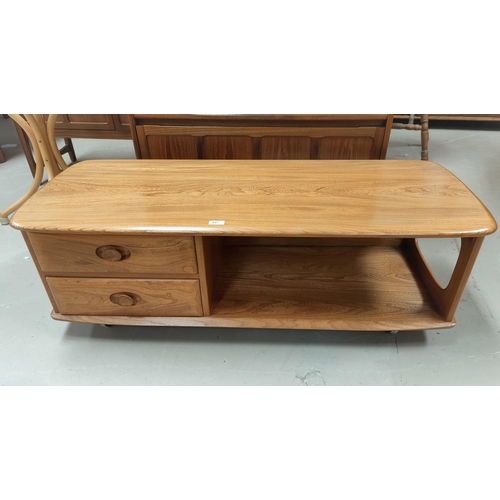 601 - An Ercol light elm 2 height coffee table fitted 2 short drawers, 124 cm