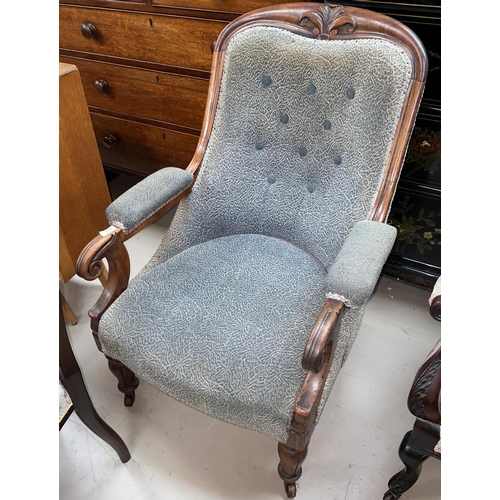 613 - A Victorian mahogany scroll armchair with curved legs