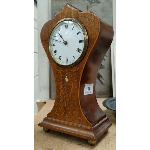104 - An Edwardian inlaid mahogany balloon top mantel clock with French drum movement