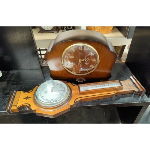 128 - A 1930's chiming wall clock; a 1950's mantel clock by Smiths; a reproduction barometer in mahogany c... 