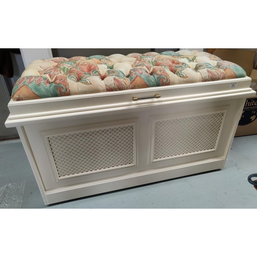 35 - A modern cream painted ottoman with deeply buttoned patterned fabric top and lattice work front pane... 