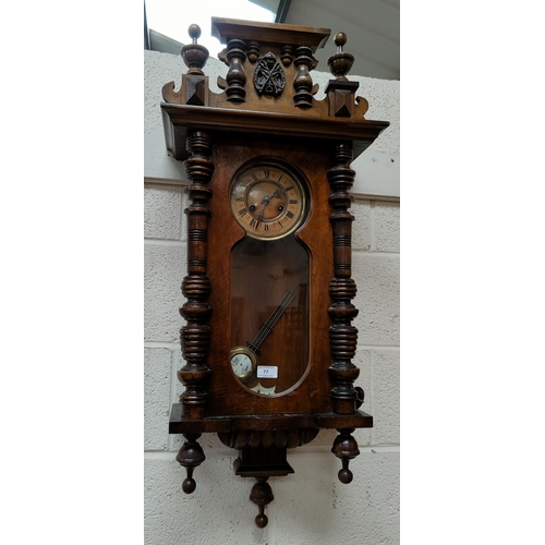 77 - A 19th century Vienna style wall clock in walnut case, with striking spring driven movement