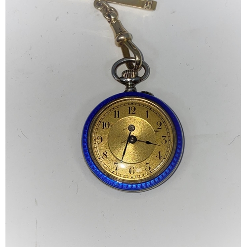 173A - An early 20th century keyless open faced white metal fob watch with gilded blue enamel decoration, g... 