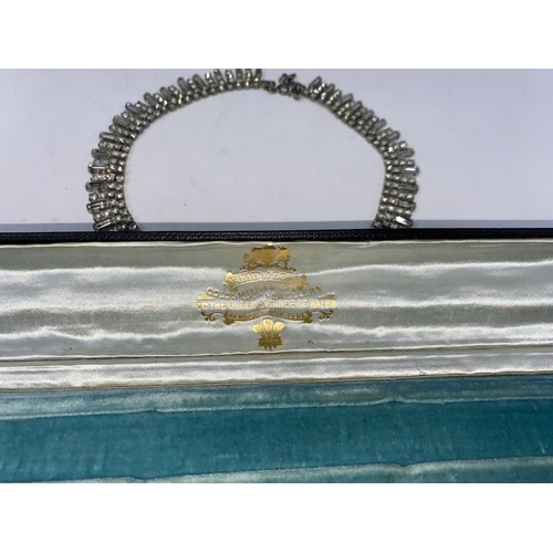 231A - A mid 20th century diamante necklace in a Victorian Case