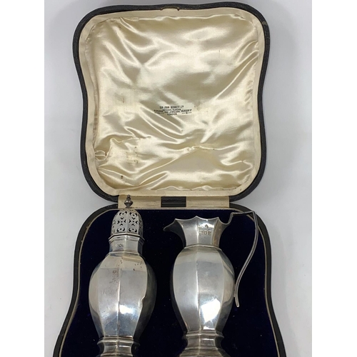 350 - A hallmarked silver strawberry set comprising octagonal cream jug and sugar sifter, London 1908, 8 o... 