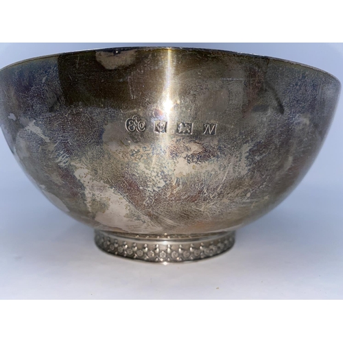 352 - A hallmarked silver plain circular fruit bowl on raised floral embossed foot, Birmingham 1936, diame... 