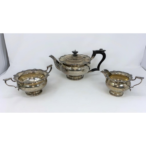 353 - A hallmarked silver 3 piece tea set in the Georgian style, circular with scalloped shell borders on ... 