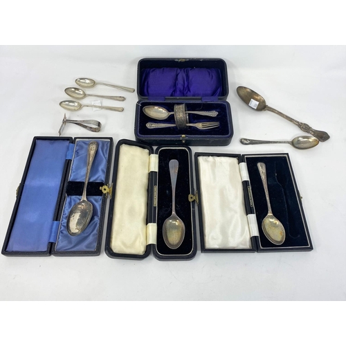 360 - A hallmarked silver christening spoon and fork, cased; other hallmarked silver cased and loose teasp... 