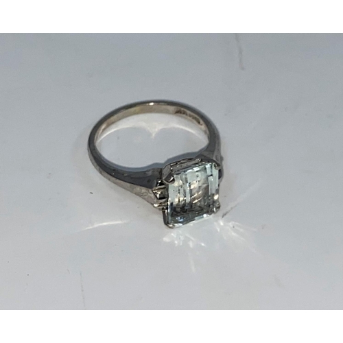 371 - A white metal dress ring set clear / pale blue cushion cut rectangular stone, stamped '14K', 2.8 gm.... 