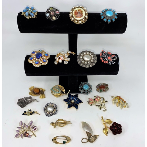 399 - A selection of various costume brooches of various forms