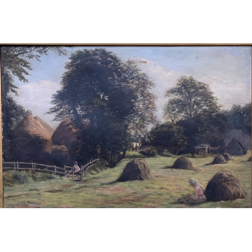 464 - A Victorian oil on canvas of a girl in a field sewing near a hay stack, unsigned in a gilt frame