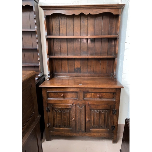504 - A good quality oak reproduction Welsh Dresser, with double cupboard and double drawers with linen fo... 