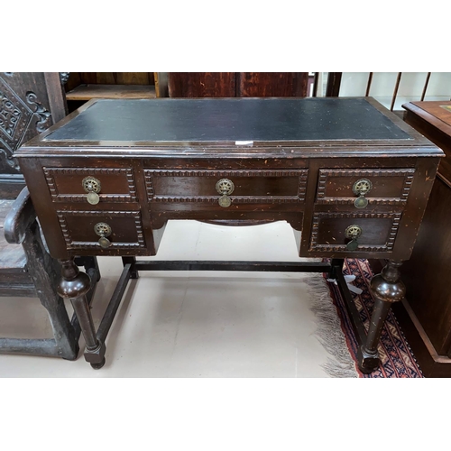 519 - A mid 20th Century Lowboy/desk with inset leather top; an oak corner TV cupboard with leaded glass d... 