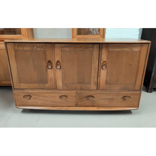 522 - An Ercol light oak sideboard of 3 cupboards and 2 drawers
Length 130cm
Height 76cm
Width 49.5cm narr... 