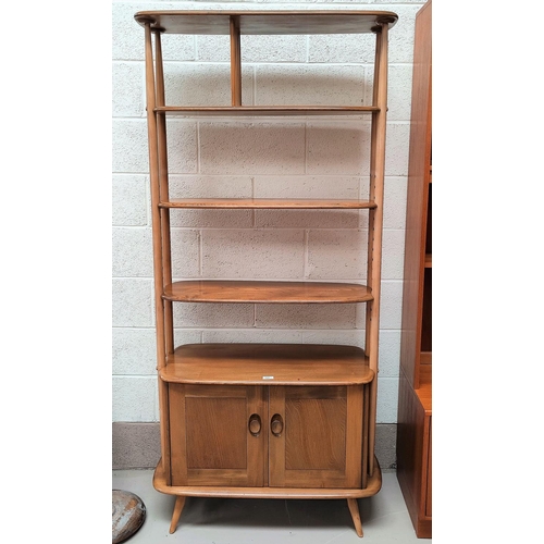 523 - An Ercol light oak wall unit\room divider of 3 shelves with double cupboard under
Dimensions; Height... 