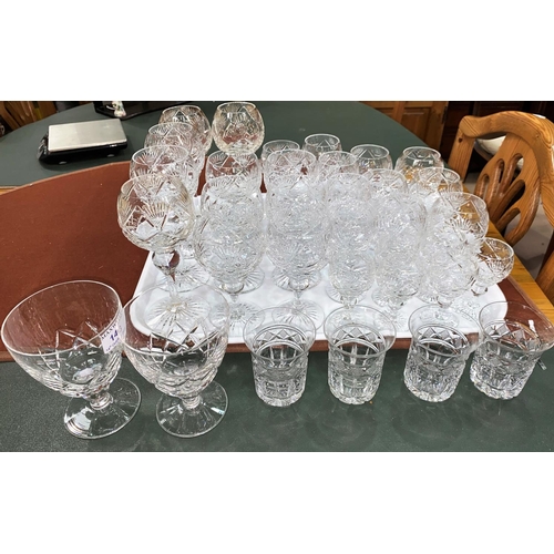 143 - A part suite of 28 cut crystal drinking glasses of various sizes including hock, brandy, sherry, and... 