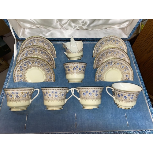 254 - A Royal Worcester bone china figure 'First Dance'; a Royal Worcester coffee set, boxed (2 cups a.f.)... 