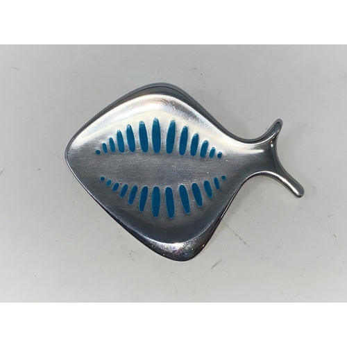 275 - Georg Jensen:  a silver brooch designed by Henning Koppel, in the form of a fish with turquoise mark... 